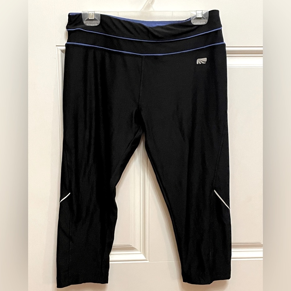 Marika Large black Capris with royal blue stripes at waistline.